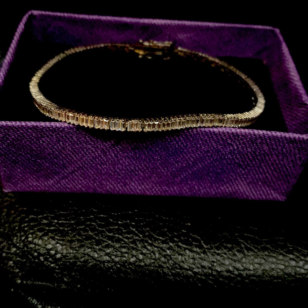 New with box. Sterling silver bracelet with emerald cut CZs. 7 inches.